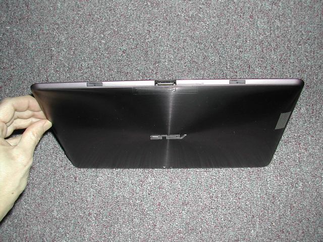 rubber stoppers cover docking ports on Asus tablet